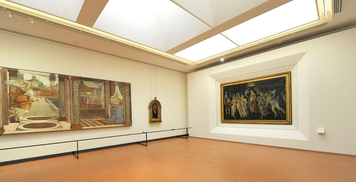 View of The Annuniciation of San Martino alla Scala (1481), and the Primavera (c. 1482), in the rehung Botticelli rooms at the Uffizi