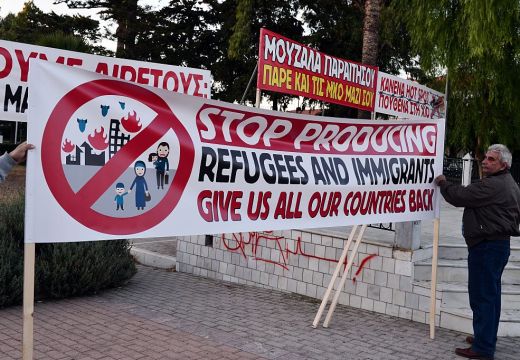 Chios residents arrange banners during an anti-migrant demo on the island of Chios on 28 September, 2016. Irish photographer Richard Mosse claims he was arrested while observing a similar rally on the island last week. Photo: LOUISA GOULIAMAKI/AFP/Getty Images